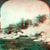 Huge armored tank making its way through a smoke screen