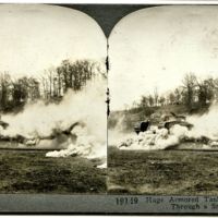 Huge armored tank making its way through a smoke screen